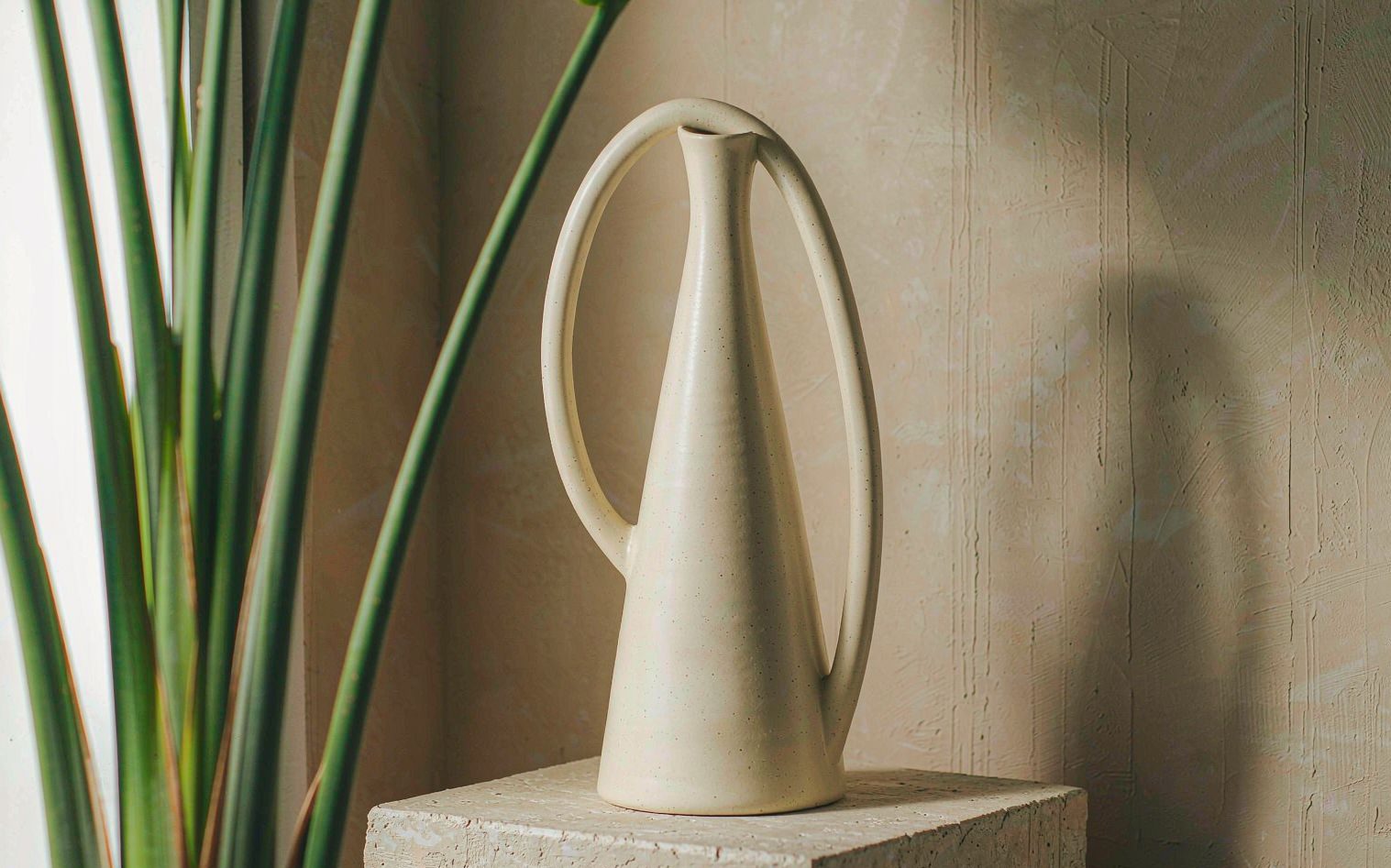 KILN 01 — a conical cream stoneware vessel on a limestone plinth