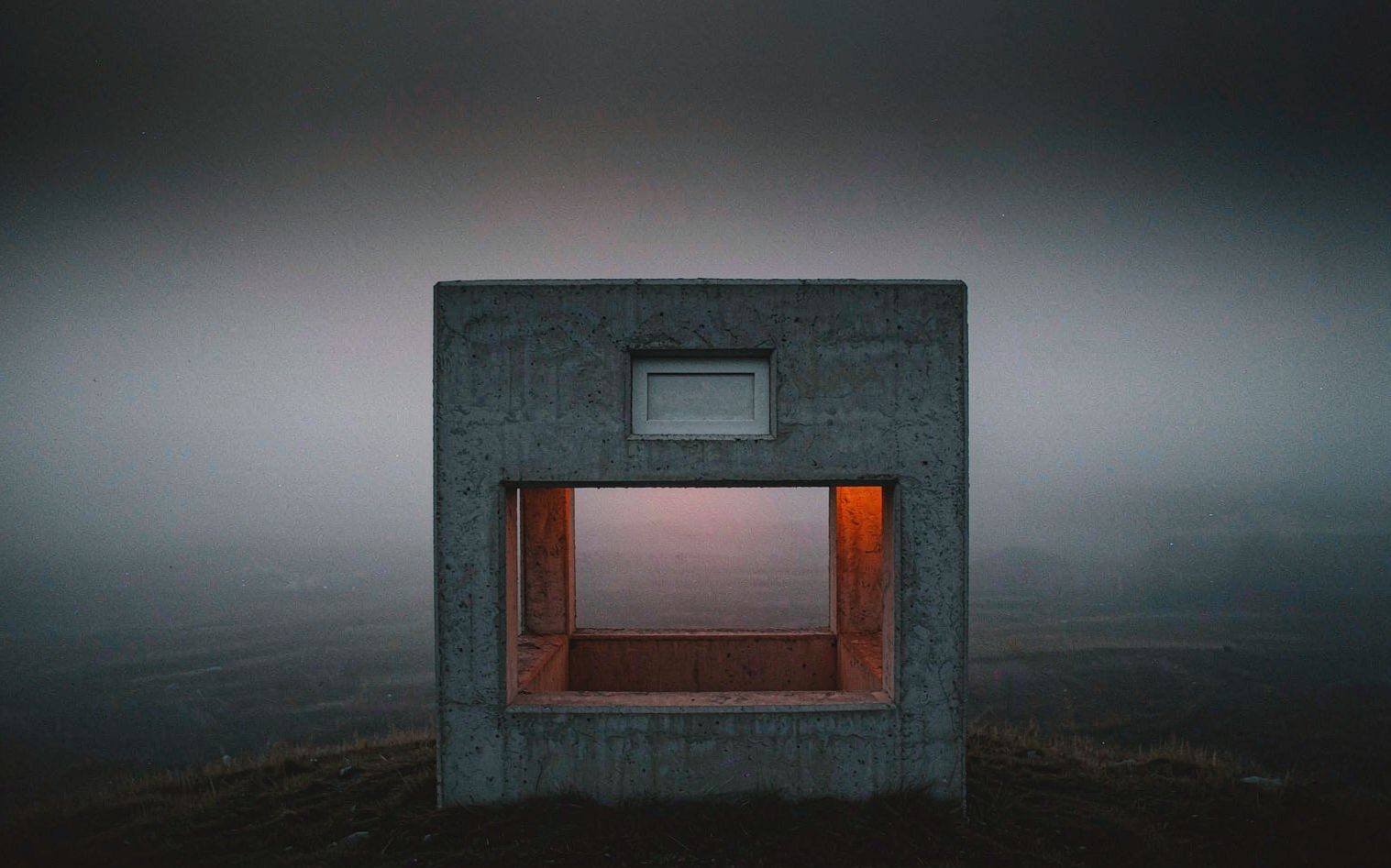 PAVILION — a concrete pavilion framing one view at dusk