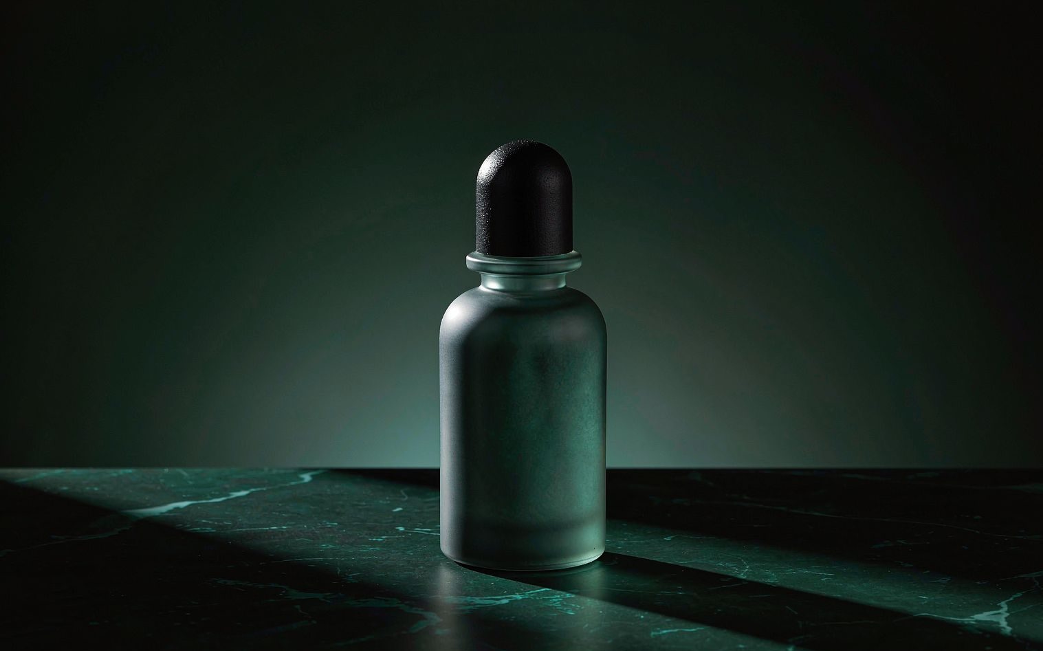 NOIR 4 — a frosted glass fragrance bottle on dark marble